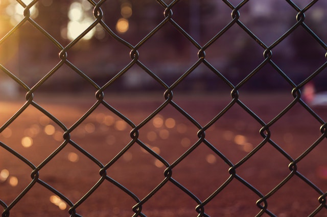 chain link fence reddish brown background