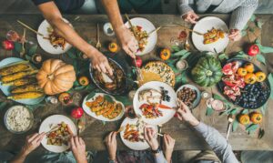 flat layout friends eating at table with turkey