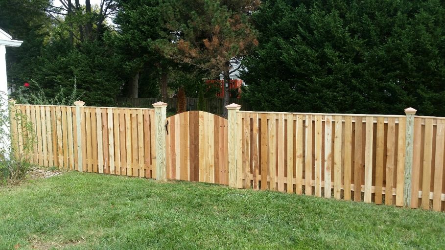 Wyngate style privacy fence, cedar pickets and copper post caps and pressure treated posts. Annapolis Maryland.