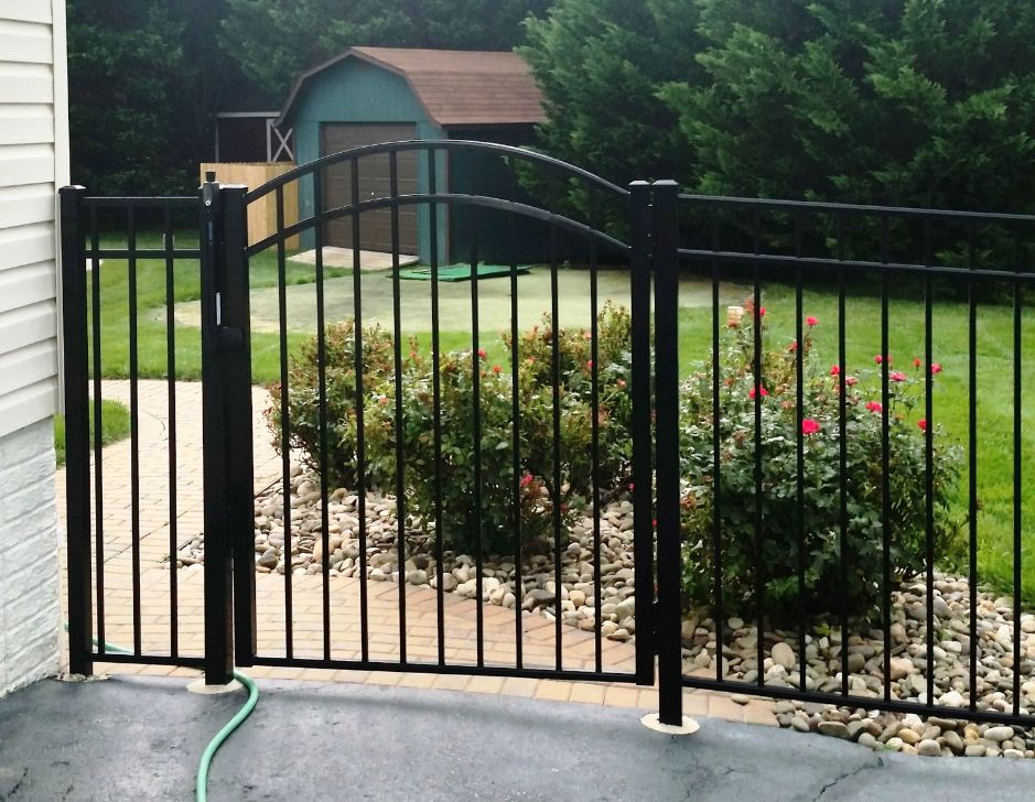 Looking for the perfect fence that blends into the background. This black 3-rail ornamental aluminum fence with arched top gate was the perfect choice for this home in Davidsonville Maryland.