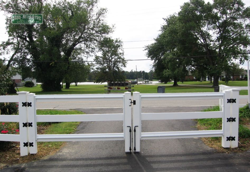White vinyl 3 rail paddock style double gate with steel frame. Deal Maryland.
