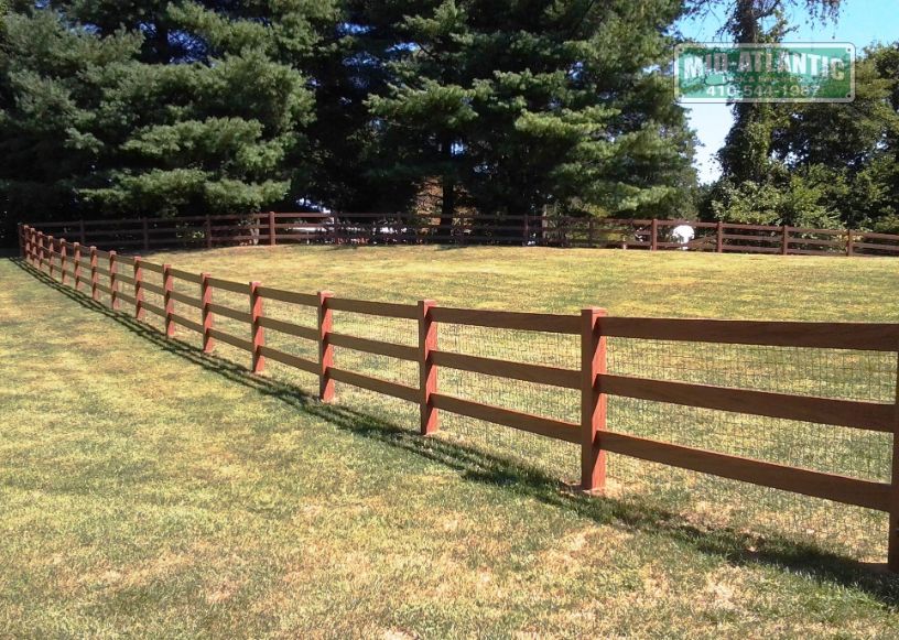 Vinyl 3 Rail paddock style fence walnut color. Davidsonville Maryland
