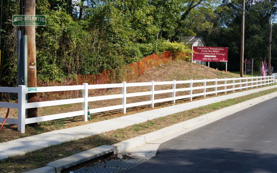 White vinyl 3 rail paddock style fence 800lf. Riva Maryland.