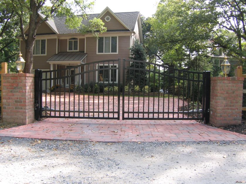 Add some brick pillars and a 12’ ornamental aluminum estate gate, it really sets off the front of this home in Severna Park Maryland.