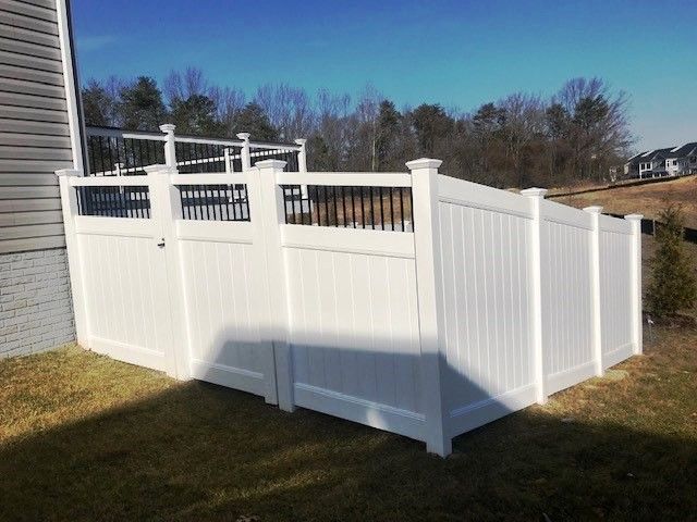 6’ tall, vinyl privacy fence, Stonington style with black aluminum round balusters. Two Rivers community in Severn Maryland.