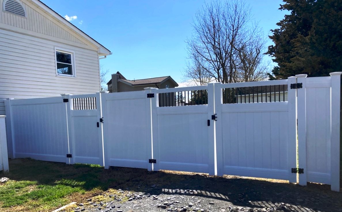 Stonington Style gates with black aluminum balusters are a nice accent to our chesterfield white vinyl privacy fence. Baltimore Maryland.
