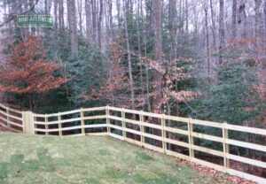 Love how this 4-rail paddock style wood fence rolls with the hills at this property in Dayton Maryland.
