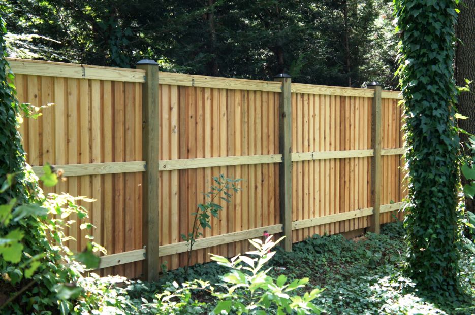 Every fence has a front and a back, some styles like this board and batten style we build in Severna Park Maryland looks great with the rail side of the fence facing in towards the property.