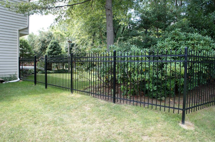 Ameristar steel ornamental with custom arched top gate was this home owners’ fence of choice. Love the look!