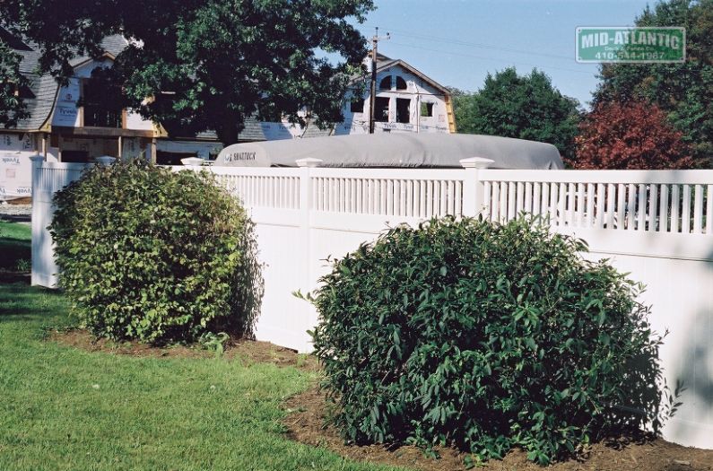 Add planting to any style fence makes for a nice look. This customer in Deal Maryland used our 6’ tall white vinyl Stonington style to gain some privacy.