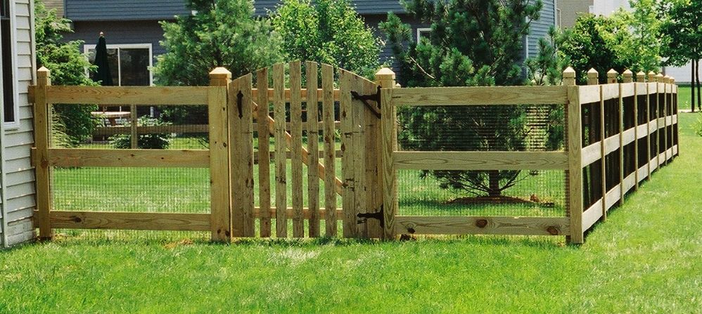 Back in Arnold Maryland again. This 3-rail paddock style wood fence was constructed for the family pet. We added black vinyl coated welded wire mesh and a custom arched top wooden picket gate.