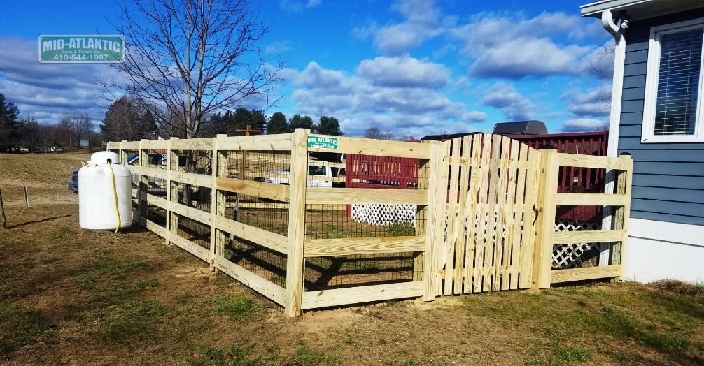 Notice how the rail spacing on the wood 4 rail paddock style fence in Burtonsville Maryland is farther apart and the bottom rail is closer to the ground. Your fence your way.