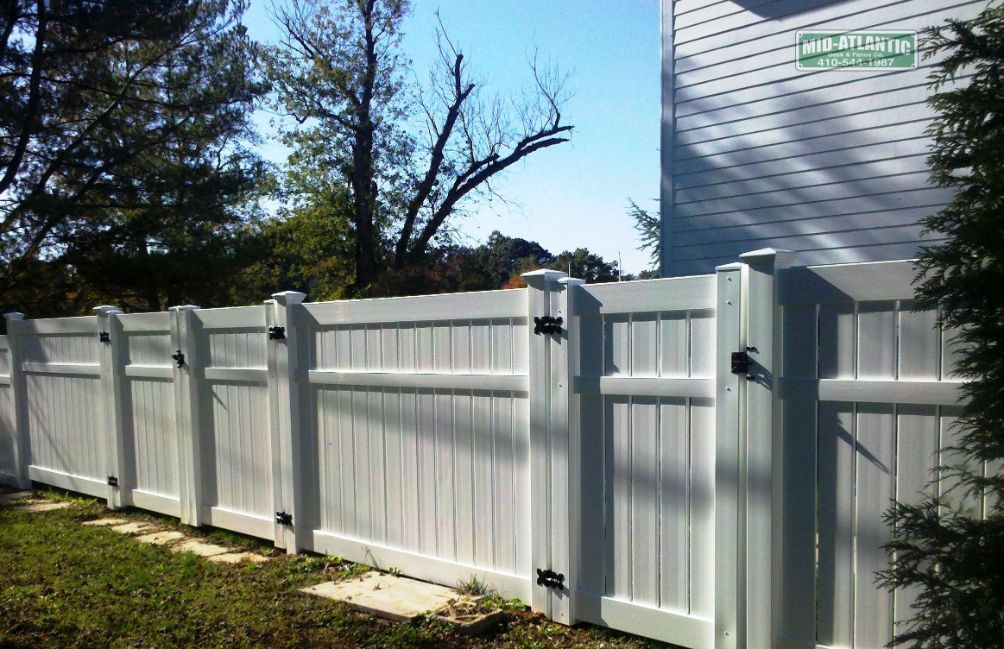 Semi-privacy white vinyl fence. the spacing between the vertical pickets is about 1”. It provides privacy but adds a little airflow to your property. Vinyl fence in Ellicott City Maryland.