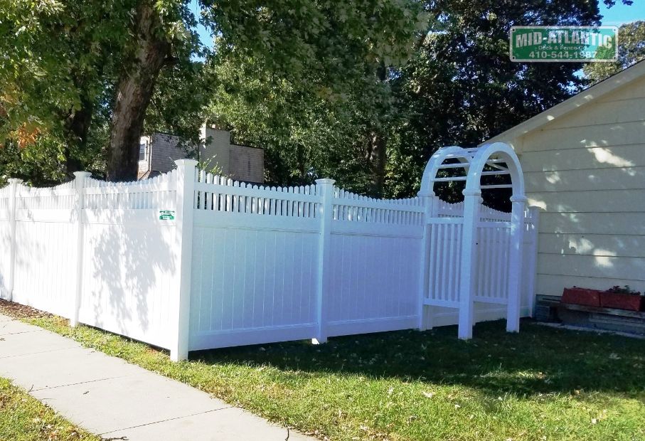 Add a custom arbor to any style fence and create a charming entrance to your property. Our Wiltshire vinyl privacy was a great choice for this home in Crofton Maryland.