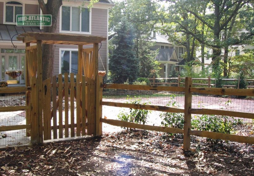 Look at this 4-post custom flat top trellis with a round top picket style gate in Severna Park Maryland. Goes well with the 3-rail fence we installed.