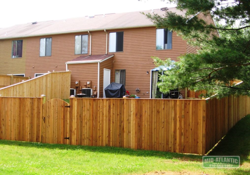 This town house in Bowie Maryland chose our vertical board style privacy fence. the solid style gate with round top really sets it off.