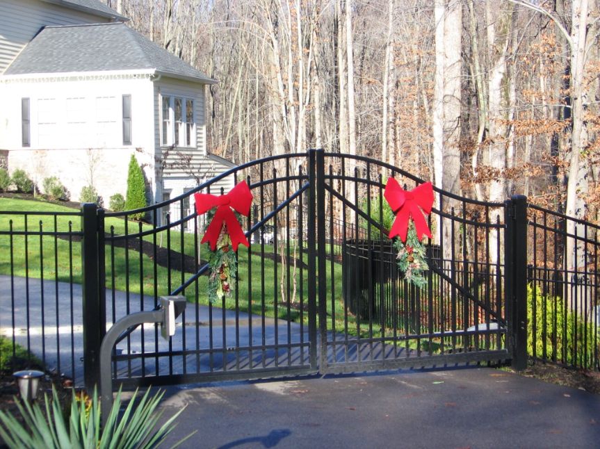 Add some bows to your ornamental estate gate was a great festive idea for this home in Davidsonville Maryland.