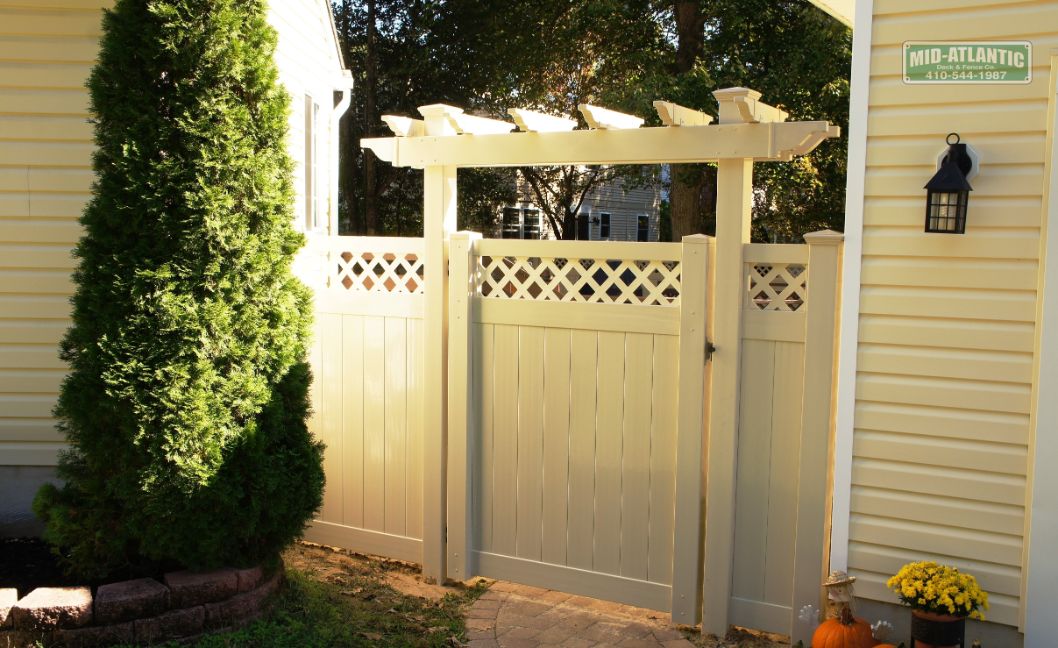 Too cute, Our Chartridge style, tan color with lattice top and custom flat top trellis over the gate.