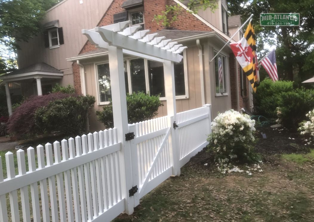 Add a flat top trellis. Makes the gate sturdier while providing a little custom accent to the front of your property. Ellicott City Maryland.