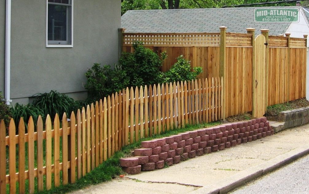 Simple gothic pick style fence in Annapolis Maryland tying into a 6’ tall board and batten style privacy fence with 1’ of lattice on top. We mix and match styles all the time.