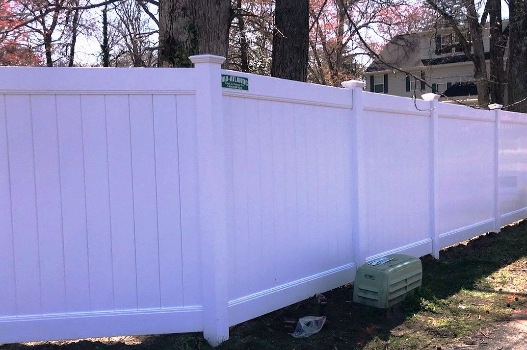 Our biggest seller. Another white vinyl privacy fence in Severna Park Maryland.