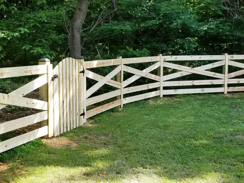 This 5-rail estate fence in Gambrills Maryland has 2” x 4” black vinyl coated wire mesh attached, for pet containment. You can barely notice it.