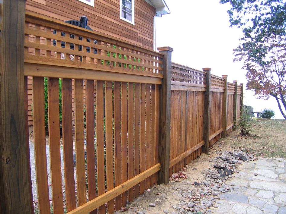 Picket fences come in all shapes and sizes. This waterfront property in Severna Park Maryland chose this fat top picket style fence with lattice on top to allow air flow and a little privacy.