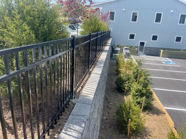 Have a retaining wall over 3’ tall odds are you will need a railing/fence. This builder in Columbia used a commercial grade aluminum fence to solve the problem. Great choice!
