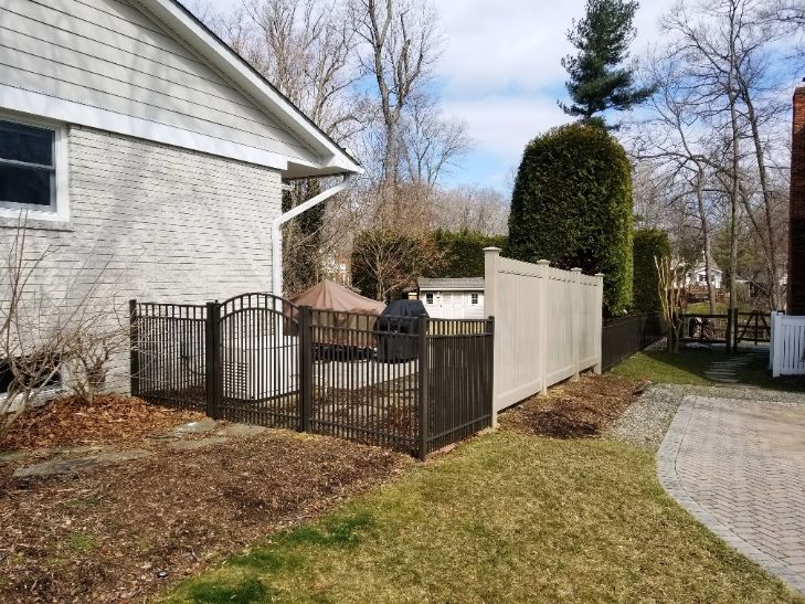 We mix and match styles and different fence materials all the time this 3-rail aluminum fence and the khaki vinyl privacy fence worked well.