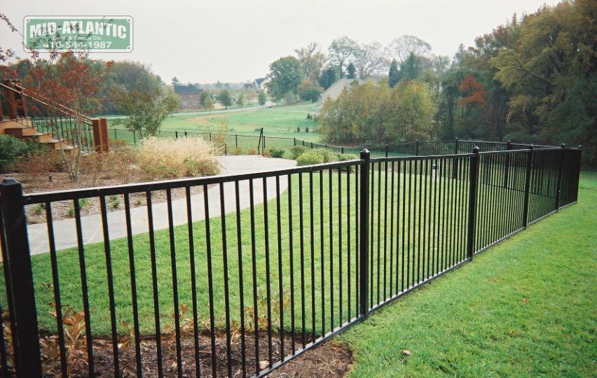 This 2-rail steel fence is simple and worked well for this customer in Montgomery County Maryland.