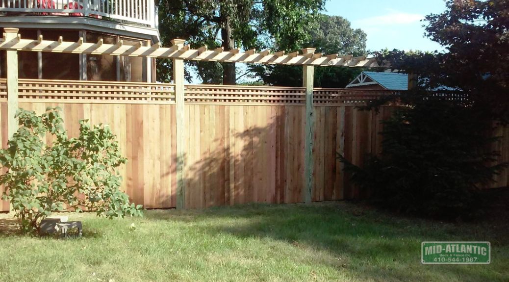 Eastport Maryland is the setting for this vertical board style cedar fence with 1’ of square lattice on top. Add a trellis for plantings and a little more height. Beautiful!