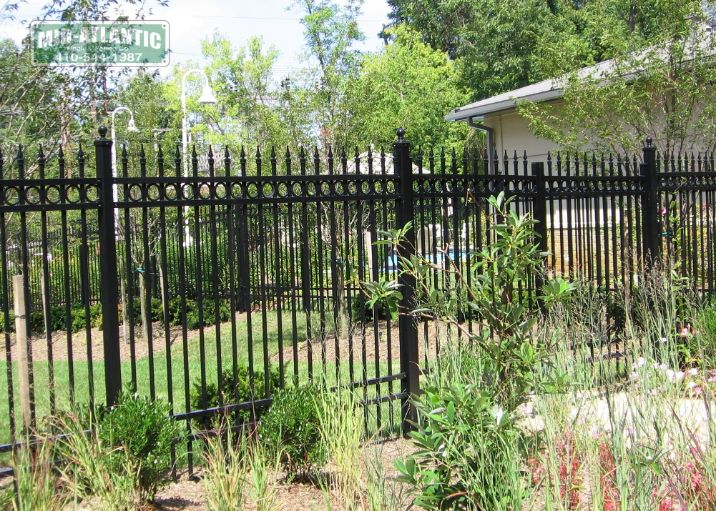 Our commercial grade aluminum fences are offered in several different heights. This customer added rings and finials to set this court yard fence off.