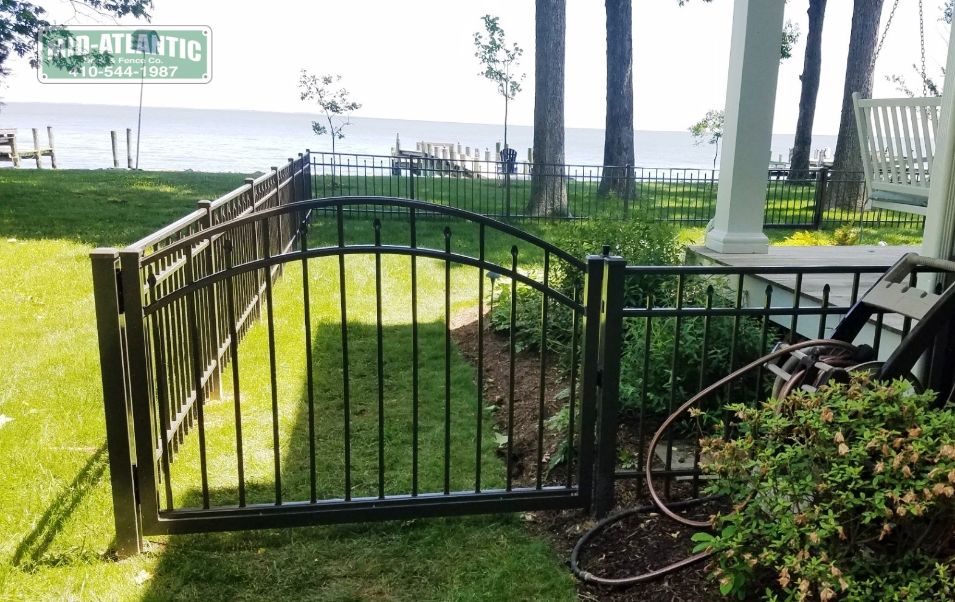 This Chesapeake beach waterfront home in Maryland had us install this 42” tall aluminum fence. Added the round top ornamental gate for a little accent.