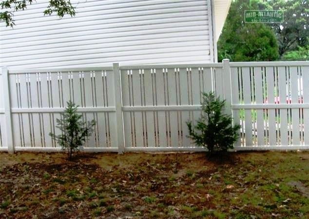 Great fences make great neighbors. This is our White vinyl Nantucket style semi-privacy fence. just enough privacy and allows airflow to the property.