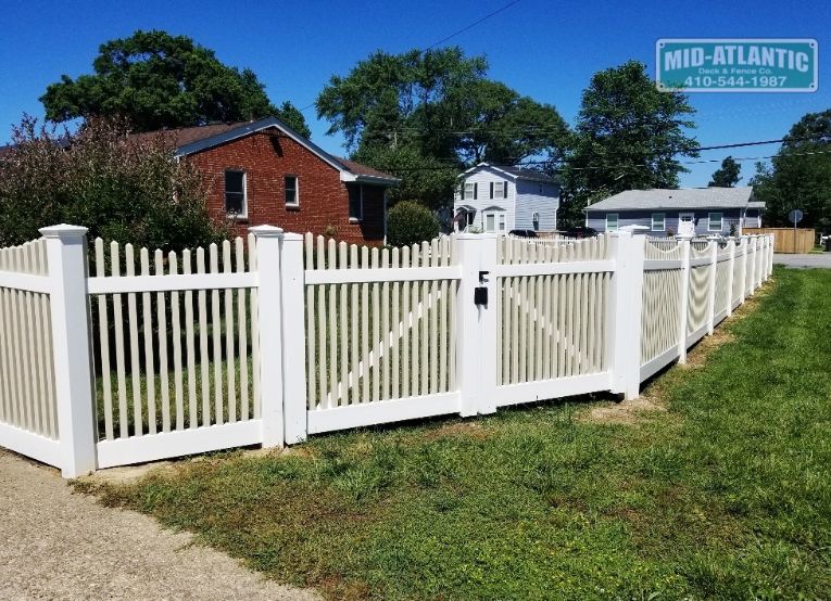 Another city another Oxford style vinyl picket fence. white frame and tan pickets add a little different perspective of this classic vinyl picket fence. Located in Mayo Maryland.