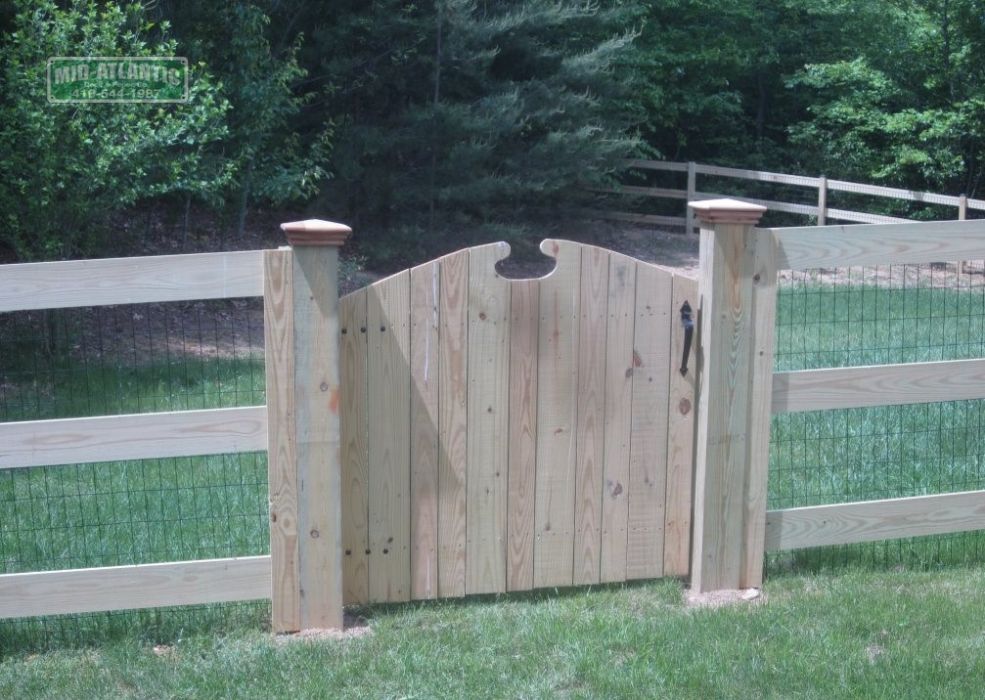 Any wood paddock style fence can be dressed up by adding a custom gate.