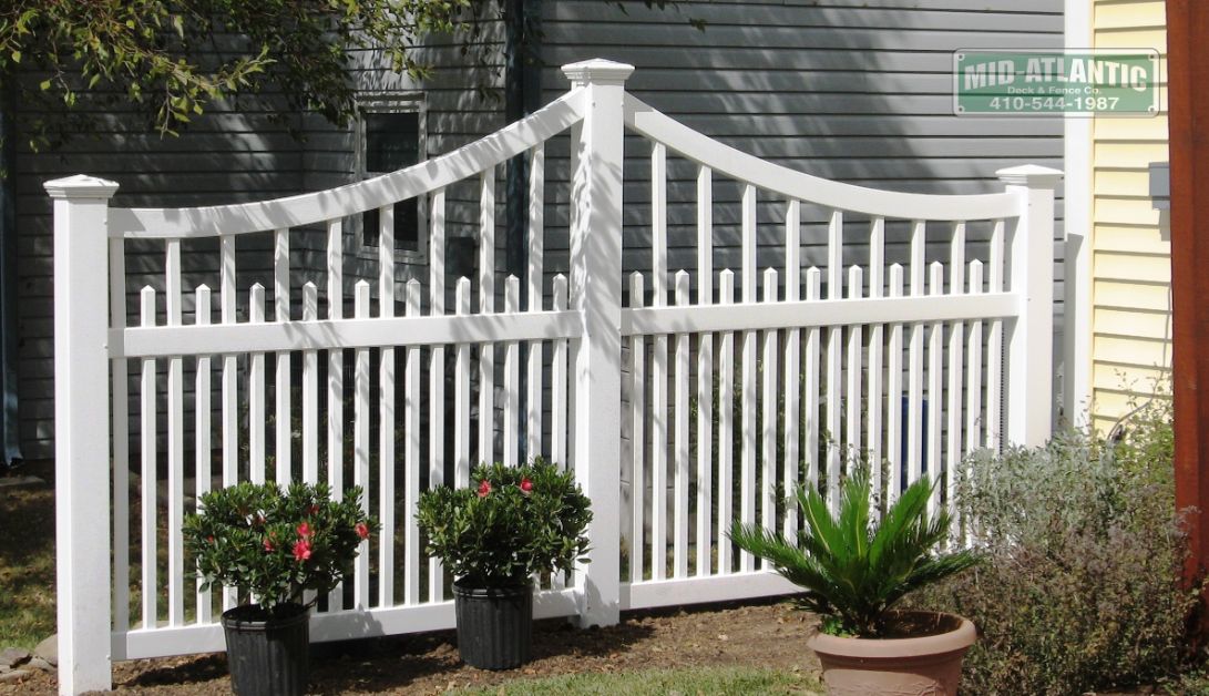 If you are into accent fencing then this Edgewater style white vinyl picket fence with scalloped tops is perfect for you. located in Crofton Maryland.