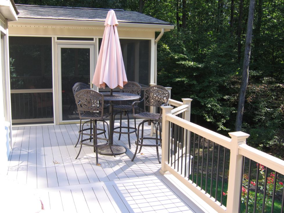 Timber Tech decking and low maintenance vinyl railing with black aluminum balusters.