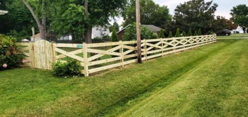 Absolutely beautiful, this 5-rail estate fence in Davidsonville Maryland was built using all1x6 pressure treated horizontal rails. Picket style gate with round top.