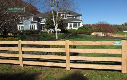 The 4-rail paddock style wood fence is a nice added touch to this home in ClarksburgMaryland.