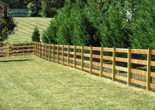 3 Rails isn’t enough this customer in Burtonsville Maryland added a 4 th rail to thispaddock style wood fence to keep his family dog safely contained in his yard.